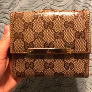 Gucci trifold wallet.
